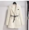 Designer's green suit jacket for women's spring and autumn 2023 new niche design, no iron early spring high-end suit top