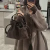 Designer Leews Bags Flamenco-Tasche, große Kapazität, weiches Leder, Kordelzugtasche, Beuteltasche, tägliche Pendel-Einkaufstasche, einfache Wolke, multifunktionale Umhängetasche