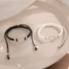 Pulsera de pareja creativa en blanco y negro, corazón hueco tejido, cadena de pie de estilo playero, pulsera ajustable de concha de mariposa