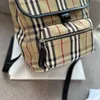 Zaino in tessuto di cotone con motivo vintage check Borsa firmata Zaini con rifiniture in pelle di lusso Borsa da viaggio stilista Archivio Zaino beige Zaini classici versatili