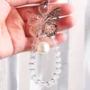 New Trendy Creative Hollow Out Butterfly Pearl Pendant Bag Keychain Phone Car Fashion Sweet Girl Bag Car Decorate Halloween Gift