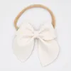 Hårtillbehör 10st/Lot 3.5 tum Faux Leather Bow pannband mjukt nylon hårband för baby flickor spädbarn tillbehör