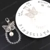 New Trendy Creative Hollow Out Butterfly Pearl Pendant Bag Keychain Phone Car Fashion Sweet Girl Bag Car Decorate Halloween Gift