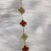 Designervan Ny koreansk version av de dubbelsidiga fem blommorna fyrbladiga klöver titanstålarmband bleknar inte med modegåva