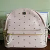 Top quality classic fashion Korean version punk rivet School Bags travel male and female student backpack220S