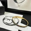 Bracelet de luxe simple femmes Bracelet de marque de créateur Design classique cadeaux en acier inoxydable bijoux bracelets de boutique plaqués or 18 carats