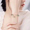 Charm-Armbänder, Kirschblüten-grünes Geister-Armband, fortschrittliches Design, Glückskristall, elastisch, Damenschmuck, Handgeschenk