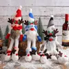 Puppen 2023 Weihnachten gesichtslose Zwergenpuppe mit langen Beinen, Geweih, Zylinder und Frohe Weihnachten-Schild 231204