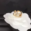 Designer de marca carta banda anéis mulheres 18k banhado a ouro prata oco latão material amor jóias de casamento anel de dedo fino escultura com selo de aço ajustável5