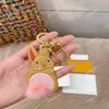 TZ Luxury Designer Keychain Little rabbit key buckle cute Pink tail Unisex Fashion Classic Brand Letter flower Design Gold Keychai212U