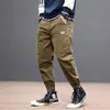 Hommes Jeans Street Fashion Hommes Gris Grande Poche Épissé Designer Casual Pantalon Cargo Hombre Hip Hop Joggers Coupe Ample Harem Pantalon 231204