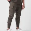 Męskie spodnie Summer stały kolor mody pot Man Casual ruch kulturystyka kieszeń sznurka elastyczna talia