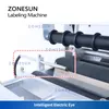 Zonesun 패킹 머신 탁상 라벨링 기계 라운드 원통형 병 수 음료 화장품 제품 라벨 애플리케이터 슬라이드 ZS-TB101