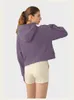 "Stay stylish and comfortable during your yoga sessions with our Women's Sports Coat Fitness Hoodie - a trendy loose fit jacket with a half zipper."