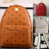 Top quality classic fashion Korean version punk rivet School Bags travel male and female student backpack232u