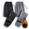 Herrbyxor i mid-rise midjan Sweatpants blixtlåsfickor sport vinterfleece fodrad jogger med dragkedja för kallt