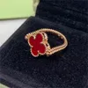 18 -karatowe luksusowe luksusowe koniczyści Designerskie pierścionki dla kobiet dziewczęta ładne obracanie podwójna strona czerwonego kamienia diamentowego Klonki Laser Laser Love Pierścień Anillos Biżuteria