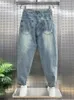 Calça jeans rasgada tendência masculina, versão coreana de calças soltas lavadas com pés pequenos, nova bola elástica com borda crua, calça casual 27