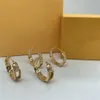 Women Fashion Ear Studs nya designer smycken Kvinnor örhängen med diamanter väver bokstäver öron damtillbehör för fest D221332D