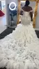 2024 New Luxury Mermaid Wedding Dress Off the Shoulder Heavy Handwork Beads Crystal Sequins Ruffles Tiered Organza Bride Formal Gowns African Vestidos De Novia