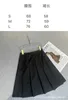 Jupes Designer BrandNew Style Socialite français Jupe mi-longue plissée fendue taille haute avec logo triangle tridimensionnel pour costume amincissant 3S1K