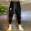 Calças masculinas de marca de luxo calça letras bordadas sólidas calças de jogging ao ar livre lazer sweatpant roupas de alta qualidade 231206