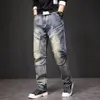 Jeans punk vintage uomini più dimensioni 40 44 pantaloni in denim stile streetwear pantaloni da carico maschio 231220