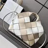 surus leather woven basket handbag features rolled handles lace-up closure Unlined Anagram soft grained cowhide strips embossed size 24 checkerboard 062840