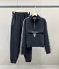 Hoodies Pullover Sweatshirt 2 stycken set i bomullsskörda kvinnors tracker lyxdesigner kort kofta tröja kappa + snörning upp breda benbyxor sportkläder kläder