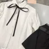 Nya flickklänningsdräkter Designer Baby TrackSuit Storlek 100-150 Single Breasted Lapel Shirt Oregelbunden kort kjol med bälte Dec05