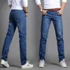 Höstkoreansk version av tonårsjeans för pojkar, trendiga män, smala fit mäns långa byxor, höst och vinter raka ben avslappnade byxor för män
