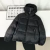 24SS Men Designer Coat Down Jacket Emboss Jacquard Leather Stand-Up Collar Down Jacket Patchwork Tyg Panelpanelen Långärmad kvinnor svart