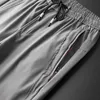 Pantaloni da uomo Primavera Estate Casual Slim Fit Chino Moda Tasca sottile con cerniera Vita elastica Pantaloni fast dry Abbigliamento maschile di marca 231206