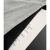 Malhas femininas Tees Designer Marca M Família Versátil Adesivo Carta de manga longa de mangas compridas para mulheres no início da primavera novo pescoço redondo sol curto sol