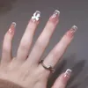 Fałszywe paznokcie 24 szt. Różowe fałszywe paznokcie nacisk na wzory paznokci sztuka długie końce fałszywe formy z naklejkami kleju
