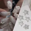 Decorações de arte de unhas 10pcsbag borboleta em forma de prego strass estrela flor charme de prata liga de ouro prego pérola jóias acessórios suprimentos de unhas 231207