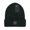 Nouveau chapeau tricoté mode lettre casquette populaire chaud coupe-vent extensible multicolore haute qualité bonnet chapeaux personnalité rue Style Couple chapeaux E-15