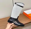 Bottes de créateurs 2023 Nouveau commerce extérieur haut baril tête ronde boucle de verrouillage en métal coloré manches à la mode bottes au genou grandes bottes pour femmes