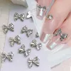 Décorations d'art d'ongle 1 sac 3D argent or en forme de nœud papillon breloques en alliage de métal coeur Nail Art strass manucure bijoux pour bricolage accessoires d'ongles 231207