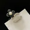 Designer Light Luxury Simple Flower Drop Glue Pearl Brooch Female High-grade Temperament Temperament Classic Fashion All-match Women's Accessories