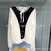 Pulls pour femmes Designer 2023 Automne / Hiver Nouvelle laine française tricotée à col rond avec nœud pour femme 3AS7
