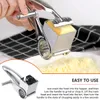 Utensili per formaggio Grattugia rotativa per formaggio con manico 3 lame a tamburo Taglierina riutilizzabile in acciaio inossidabile Affettatrice per burro Trituratore portatile Gadget da cucina 231206