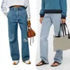 Jeans para hombres Diseñador Jeans para mujeres Llegadas Cintura alta Calle Ahuecado Parche Decoración bordada Casual Azul Pantalones de mezclilla rectos Lujo