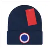 Diseñador Invierno Gorro de punto Gorro de lana Hombres Mujeres Punto grueso Grueso Cálido Piel sintética Pom Gorros Sombreros Gorro femenino Gorros 22 colores B-5