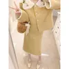 Robe de deux pièces jaune style doux costume veste jupe jupe socialite élégant français haut automne et hiver ensemble deux pièces de haute qualité