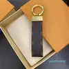 Ontwerper - sleutelhanger lederen sleutelhanger mannelijke gepersonaliseerde tas charme vrouwelijke autosleutel charme klassieke oude bloem paar luxe mode trendy cadeau