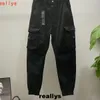 Spodnie projektant mężczyzn Purple Emblem Stones Island Cargo Work Pants luźne szerokie nogi spodnie harlanowe spodni Radish Spodnie Multi Pocket Sport