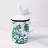 Designer mokken Hoge uitstraling Vlinderdeksel Bone China Waterbeker Melk Koffiekopje Keramische mok met deksel Handgreep Groene geschenkdoos Verpakking