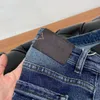 Designer Mäns tryckt broderade bokstäver Solid färg vintage tvätt jeans Löst stretch rak tvätt slitage resistenta övre raden lapp casual byxor