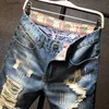 Męskie dżinsy 2023 Summer Nowe nowe męskie Raped Short Dżinsy Streetwear Big Hole Fashion Vintage Blue Slim Denim Shorts Brandl231209